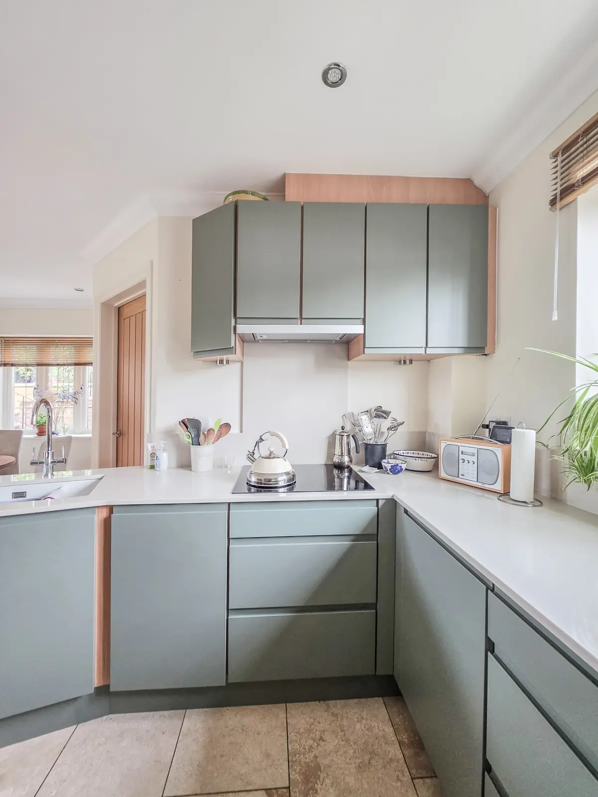 New Dekton worktop and induction hob with under-cabinet LED lighting above