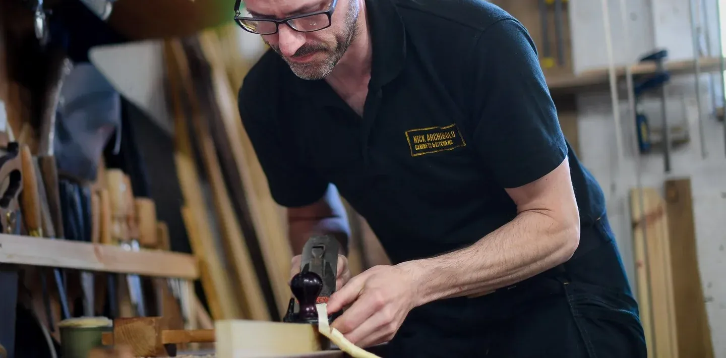 Cabinetmaking workshop with hand planes, chisels and timber